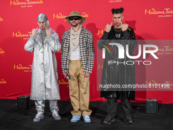 EW YORK, NEW YORK - APRIL 19: Bad Bunny (C) reveals wax figures for Madame Tussauds New York and Madame Tussauds Orlando at Madame Tussauds...