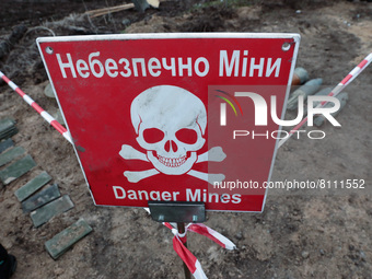 KYIV REGION, UKRAINE - APRIL 21, 2022 - The 'Danger Mines' warning sign is pictured during a mine clearance mission near Bervytsia, a villag...