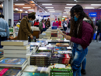 Book buyers see the latest editions of their favorite literature genres during the first Sunday of Bogota's International Book Fair 'FILBO'...