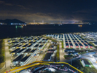 Hong Kong, China, 24 Apr 2022, The Penny Bay's Community Isolation Facility seen by drone at night. (