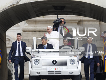 Pope Francis arrives on the popemobile to attend his weekly open-air general audience in St. Peter's Square at The Vatican, Wednesday, May 4...