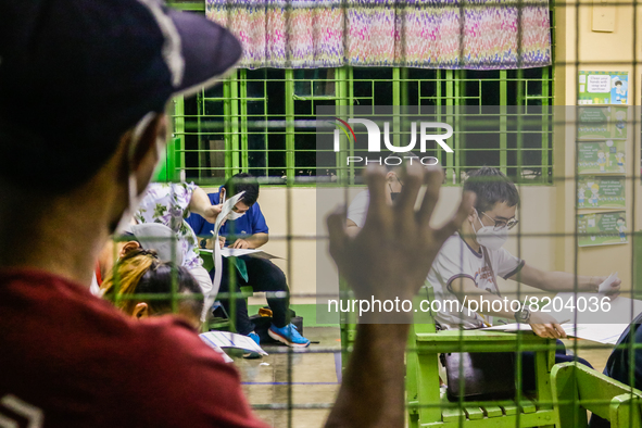 Scene inside polling precinct during the National and Local Elections in Metro Manila, Philippines on May 9, 2022. Filipinos cast their vote...