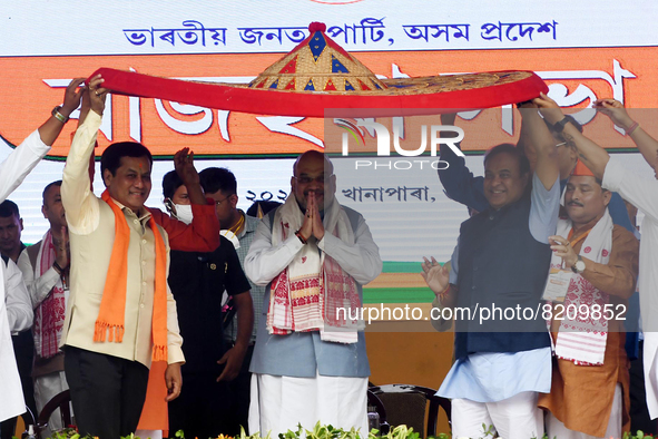  India's Home Minister Amit Shah with Assam Chief Minister Himanta Biswa Sarma and Union Minister Sarbananda Sonowal during a public rally,...