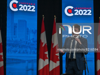 Conservative leadership candidate Roman Baber answers journalists' questions at the end of the Conservative Party of Canada English leadersh...