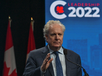 Conservative leadership candidate Jean Charest answers journalists' questions at the end of the Conservative Party of Canada English leaders...