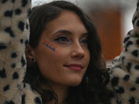 An activist with a sticker-tattoo 'Pride' on the cheek.
More than 100 local LGBTQ2S + supporters gathered Friday evening at the southeast co...