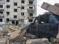 Civil vehicle and residential building destroyed during russia's invasion in Ukraine, in the Borodianka town, Kyiv aria, Ukraine May 13, 202...