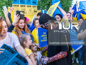 Ukraine's Kalush Orchestra joins a Ukrainian diaspora flashmob before his concert at Eurovision village on May 11, 2022, in Turin, Italy. At...