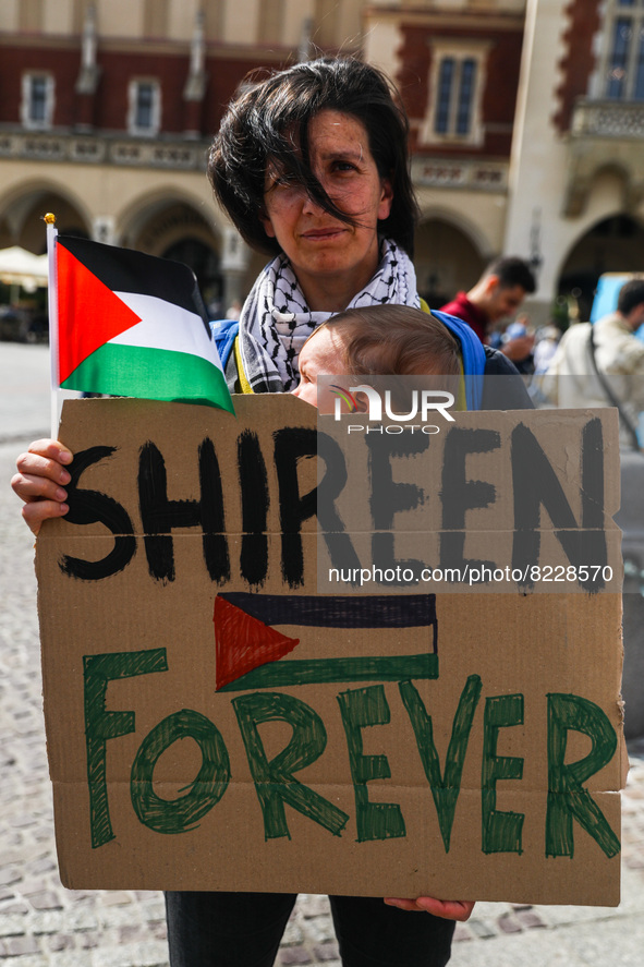 A woman holds a banner reading 'Shireen Forever' while attending Solidarity with Palestine protest at the Main Square to mark the 74th anniv...