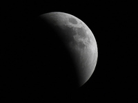 May 15, 2022 - The moon is partly covered in the earth's shadow during a phase of the lunar eclipse on May 15, 2022 in Orlando, Florida. The...