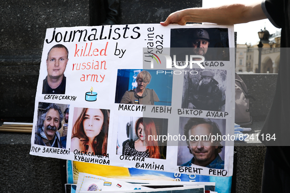 A poster with journalists killed during the Russian invasion on Ukraine is seen on the demonstration in Krakow, Poland on May 16, 2022. 