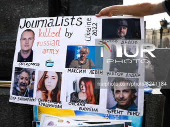 A poster with journalists killed during the Russian invasion on Ukraine is seen on the demonstration in Krakow, Poland on May 16, 2022. (