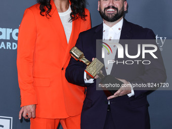 Dan Smyers and Shay Mooney of Dan + Shay pose with the Top Country Duo/Group award in the press room at the 2022 Billboard Music Awards held...