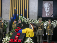 Former President of Ukraine Petro Poroshenko bids farewell to the body of the first President of Ukraine Leonid Kravchuk during a ceremony h...