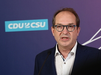 Christian Social Union (CSU) parliamentary group leader Alexander Dobrindt gives a statement to the media prior to the meeting in Bundestag...