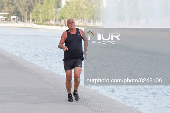 A man runs at Stavros Niarchos Cultural Centre in Athens on 17 May 2022. 