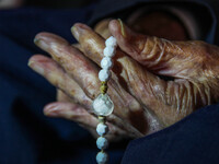 Detail of Juan VIcente Mora's hands holding a beaded rosary during an interview. San José de Bolivar, January 24, 2022. The oldest man in th...