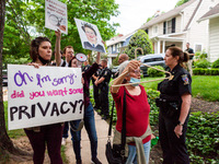 Pro-choice protesters walk past police and federal marshals standing in front of Chief Justice John Roberts’ house in Chevy Chase, MD.  Demo...