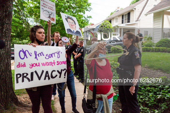 Pro-choice protesters walk past police and federal marshals standing in front of Justice Brett Kavanaugh’s house in Chevy Chase, MD.  Demons...