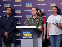 KYIV, UKRAINE - MAY 14, 2022 - Officer with the Ukrainian Marines Hanna Ivleieva, the wife of a Mariupol defender, delivers a speech during...