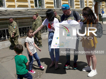 ODESA, UKRAINE - MAY 12, 2022 - People forced to leave their homes because of the russian aggression get ready to board an evacuation bus to...