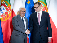 Polish Prime Minister Mateusz Morawiecki welcomes Portuguese Prime Minister Antonio Costa as they meet at the Chancellery in Warsaw, Poland...