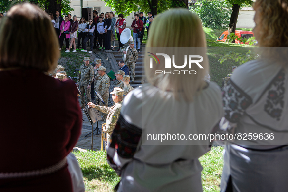 Members of the Ukrainian Armed Forces perform in front of a crowd on Vyshyvanka Day in Lviv on May 19, 2022. On this day Ukrainians wear the...