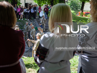 Members of the Ukrainian Armed Forces perform in front of a crowd on Vyshyvanka Day in Lviv on May 19, 2022. On this day Ukrainians wear the...
