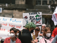 Dozens of activists take part in Fridays for Future rally and demand more green economy policies into government policy in Cologne, Germany...