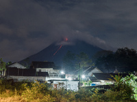 Mount Merapi covered with cloud spews lava as seen from Girikerto village in Sleman, Yogyakarta, Indonesia on May 22, 2022. The Indonesian C...