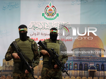 Palestinian militants from the joint operations room of the Palestinian resistance factions attend the national conference on the first anni...