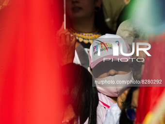 A supporter is seen usigna campaign promotional cap during the closing campaign rally of left-wing presidential candidate for the political...