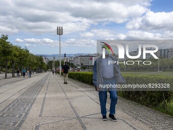 A man wearing a protective mask is seen walking in the vicinity of the Eduardo VII garden. Lisbon, May 23, 2022. Portugal is the European Un...