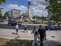 People are seen walking near the monument to the Marquis of Pombal. Lisbon, May 23, 2022. Portugal is the European Union country with the mo...