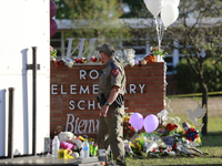 An officer is seen in front Robb Elementary School in Uvalde, Texas, May 25, 2022. (
