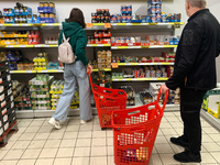 People are seen during shopping in a supermarket in Krakow, Poland on May 24, 2022. (
