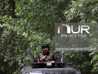  An Indian army vehicle moves near the site of gun-battle in south Kashmir's Pulwama on May 30, 2022.Two militants of Jaish-e-Muhammad milit...