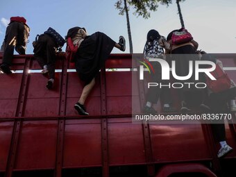 Students are huddling together in a truck to going school in Tugu Utara Village, Regency Bogor, West Java province, Indonesia on 2 June, 202...