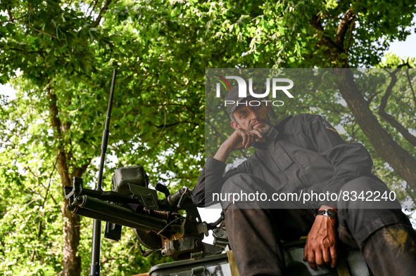 DONETSK REGION, UKRAINE - MAY 31, 2022 - A tank man of the Armed Forces of Ukraine waits for the departure command to perform a combat missi...