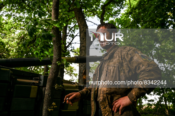 DONETSK REGION, UKRAINE - MAY 31, 2022 - A tank man of the Armed Forces of Ukraine waits for the departure command to perform a combat missi...