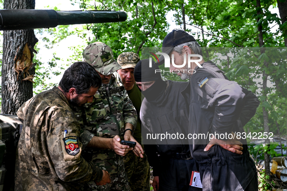 DONETSK REGION, UKRAINE - MAY 31, 2022 - Tank men of the Armed Forces of Ukraine wait for the departure command to perform a combat mission...