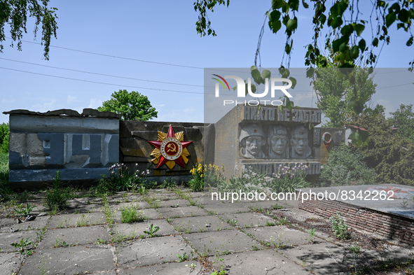 DONETSK REGION, UKRAINE - MAY 31, 2022 - Monument to soviet soldiers damaged as a result of russian shelling in the village of Zelene Pole,...