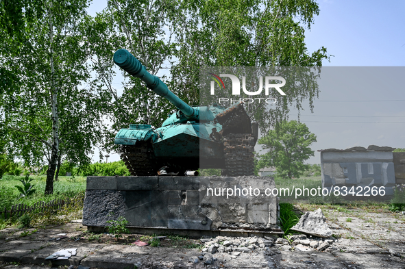 DONETSK REGION, UKRAINE - MAY 31, 2022 - A World War II tank that is part of a monument to soviet soldiers damaged by the russian shelling i...