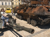 Child looks at destroyed Russian armored vehicles displayed for Ukrainians to see at Mykhailivska Square in downtown Kyiv, Ukraine, June 03,...
