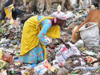 A ragpicker look for recyclable material at the Boragaon garbage dumping site in Guwahati ,india on June 4,2022.World Environment Day is the...