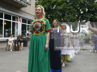 Ukrainian age plus models wearing traditional embroidered clothing display an ethnic collection 'Our Ivanka' by Ukrainian designer Natlia Da...