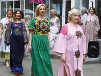 Ukrainian age plus models wearing traditional embroidered clothing display an ethnic collection 'Our Ivanka' by Ukrainian designer Natlia Da...