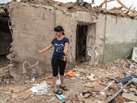 The owner of the house is seen inside her damaged house, due to the recent shelling of a smerch rocket from Russian controlled territory, in...