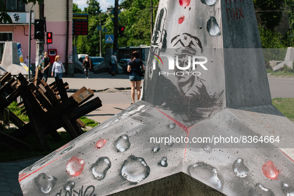 Protective unit with patriotic graffiti on the street of Poltava, Ukraine on June 6, 2022. 