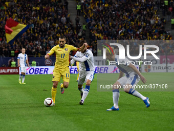 Lucian Sanmartean #17 of Romania National Team and Perparim Hetemaj #8 of Finland National Team  in action during the UEFA Euro 2016 Qualify...